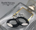 Load image into Gallery viewer, Swarovski Black Plastic Ovals Vibrant Clear Crystals Dangle Drop Clip Earrings