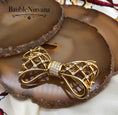 Load image into Gallery viewer, Vintage Swan Signed Swarovski Bow & Ribbon Criss Cross Brooch Pin
