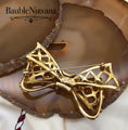 Load image into Gallery viewer, Vintage Swan Signed Swarovski Bow & Ribbon Criss Cross Brooch Pin