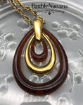 Load image into Gallery viewer, Vintage Retro 1970s Amber Lucite & Goldtone Trifari Three Loop Pendant&Necklace