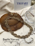 Load image into Gallery viewer, necklace earrings set on a textured surface with 'TRIFARI Jewels' branding.