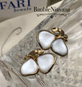 Load image into Gallery viewer, Vintage Trifari Molded White Glass Overlapping Leaves Clip Earrings
