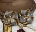 Load image into Gallery viewer, Vintage Signed Swarovski Gold Plated Austrian Crystal Open Ribbon Bow Earrings
