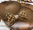 Load image into Gallery viewer, Vintage Swan Signed Swarovski Bow & Ribbon Criss Cross Brooch Pin
