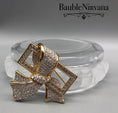 Load image into Gallery viewer, Signed Swarovski Gold Plated Crystal Bow Brooch
