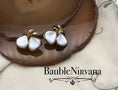 Load image into Gallery viewer, Vintage Trifari Molded White Glass Overlapping Leaves Clip Earrings
